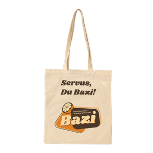 Bazi Jute Beutel in der Farbe creme. Bedruckt auf einer Seite mit dem Bazi Cola-Mix Logo und der Aufschrift "Servus du Bazi"